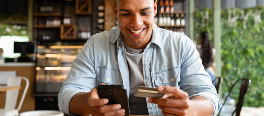 man with his phone and card