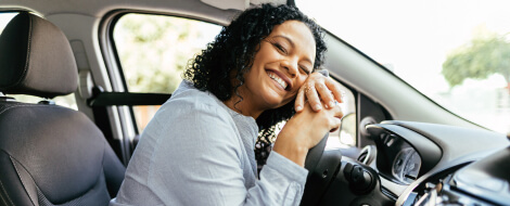 smiling women in a new car