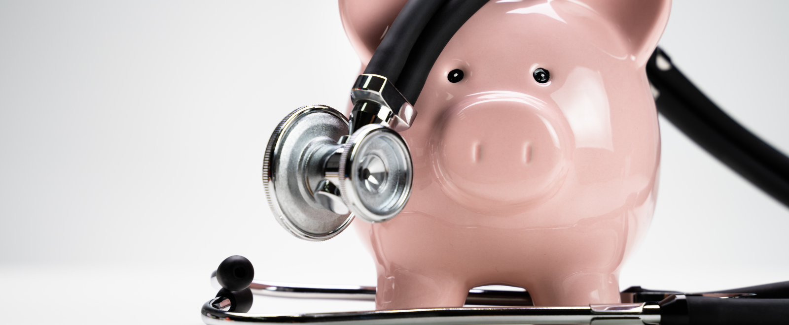 Piggy bank with stethiscope